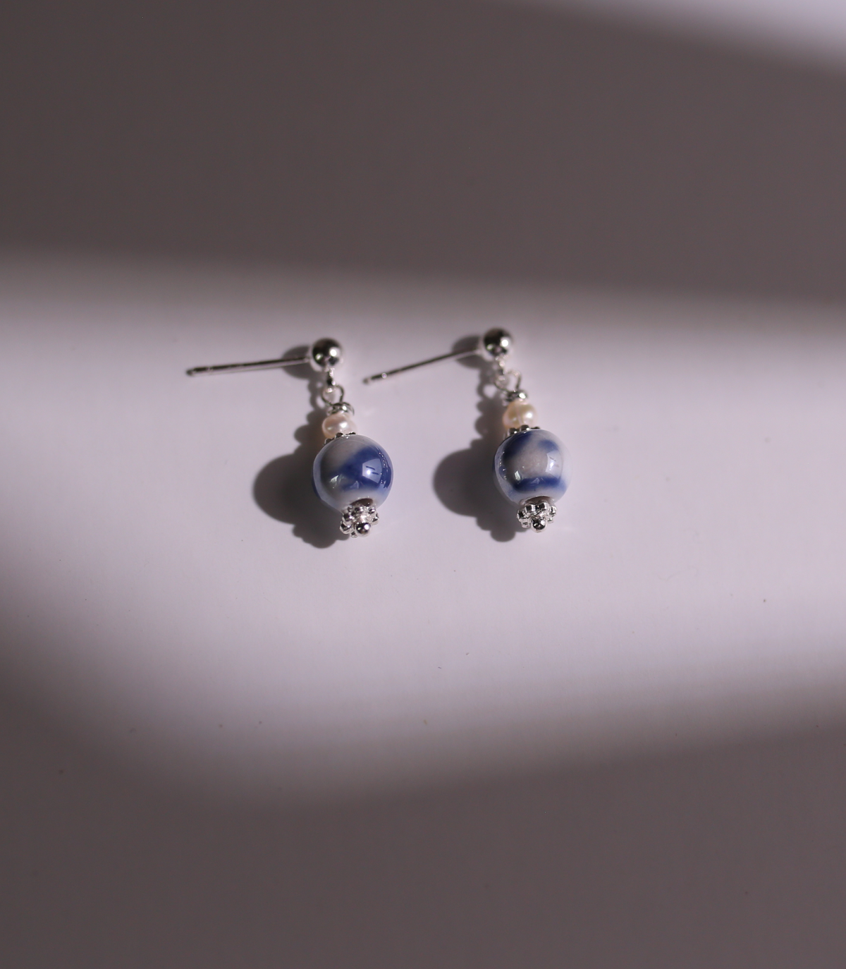 Blue porcelain necklace product still life
